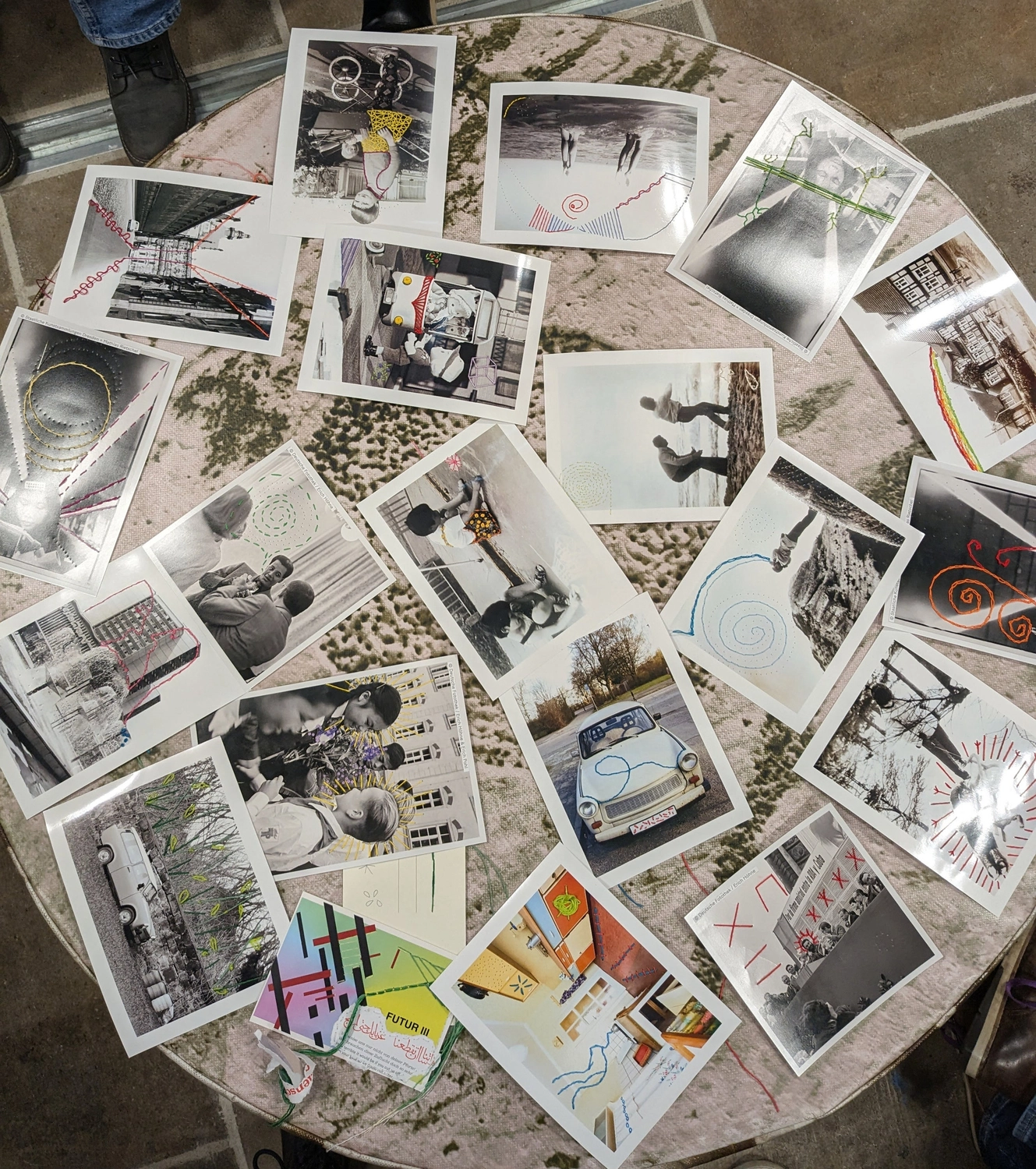 Embroidered photographs created by workshop participants