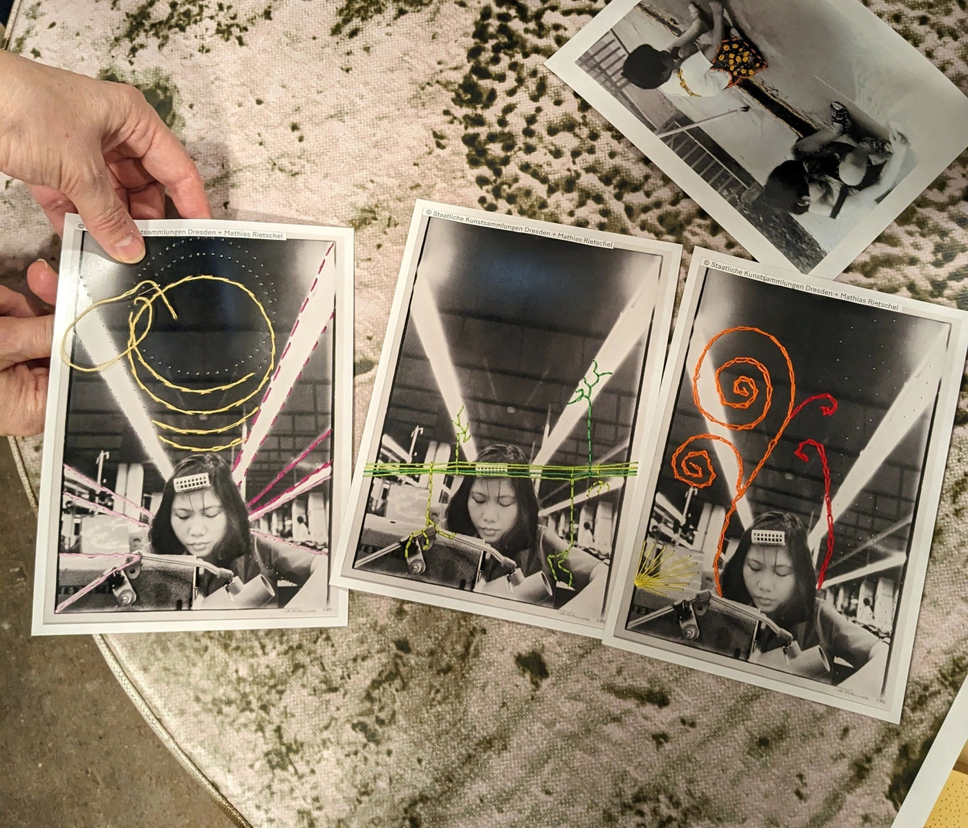 Embroidered photographs created by workshop participants