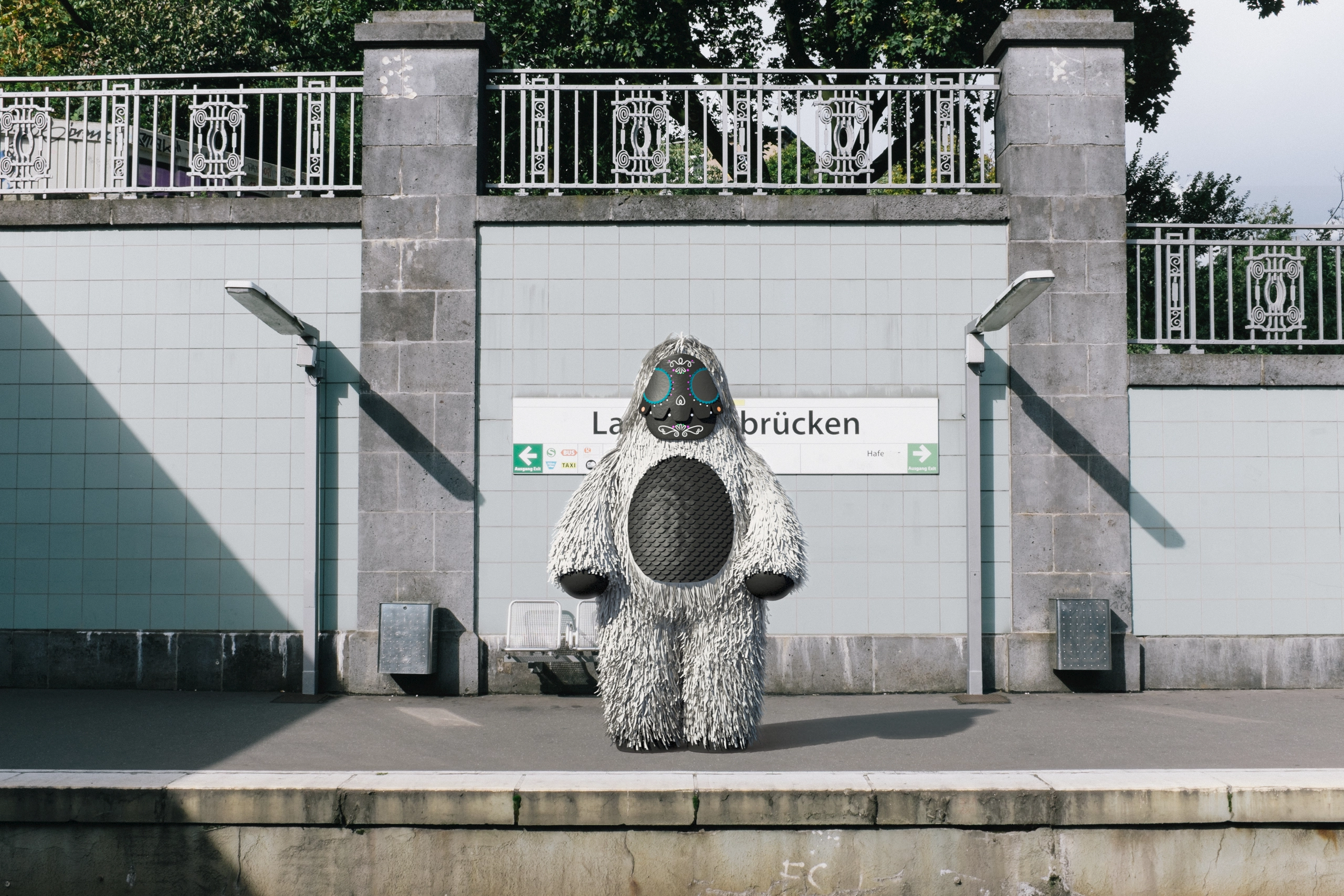 The Landungsbrücken U-Bahn platform in Hamburg, empty but for him. No train is recorded arriving or leaving.