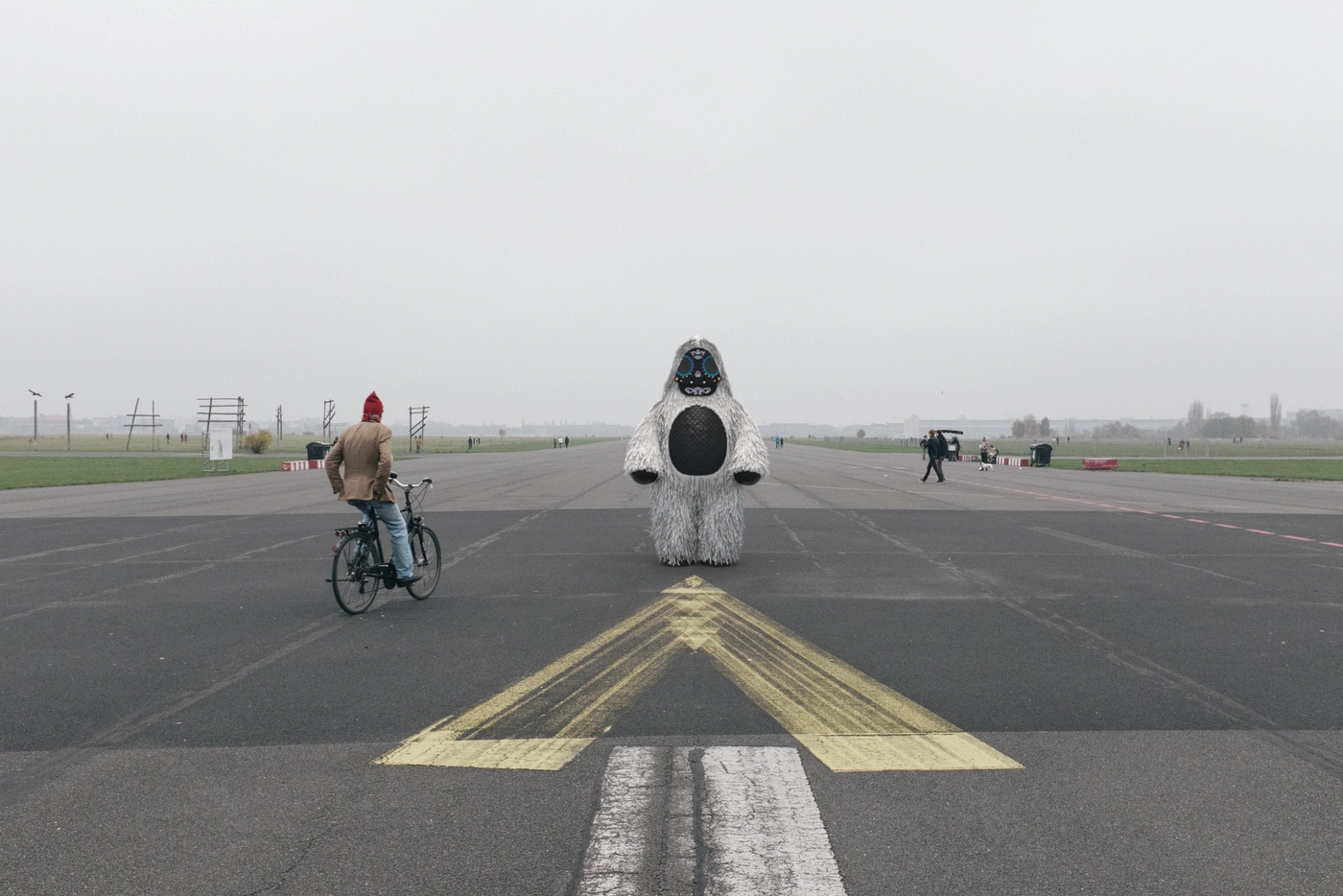 The old runway at Tempelhof, wide open and otherwise empty. A cyclist crossed the frame and rode on, taking no notice.